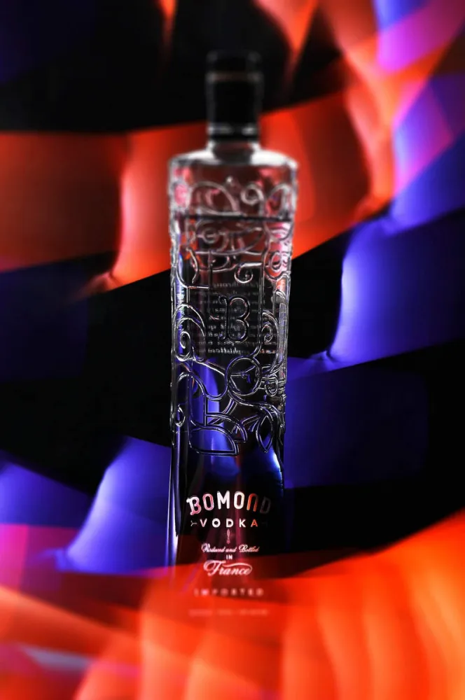 Bomond Vodka bottle photographed with red, blue, and violet studio lighting